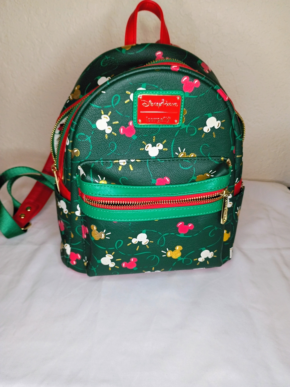 Disney Green Mini Backpack with Red Accents and Multicolor Mickey Icons